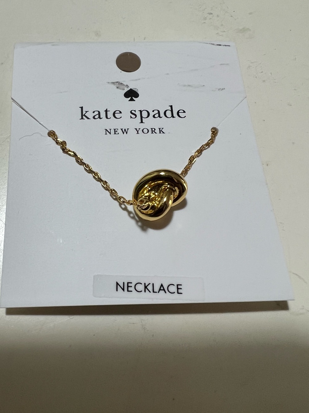Kate Spade New York Sailors knot mini pendant gold plated necklace. NWT